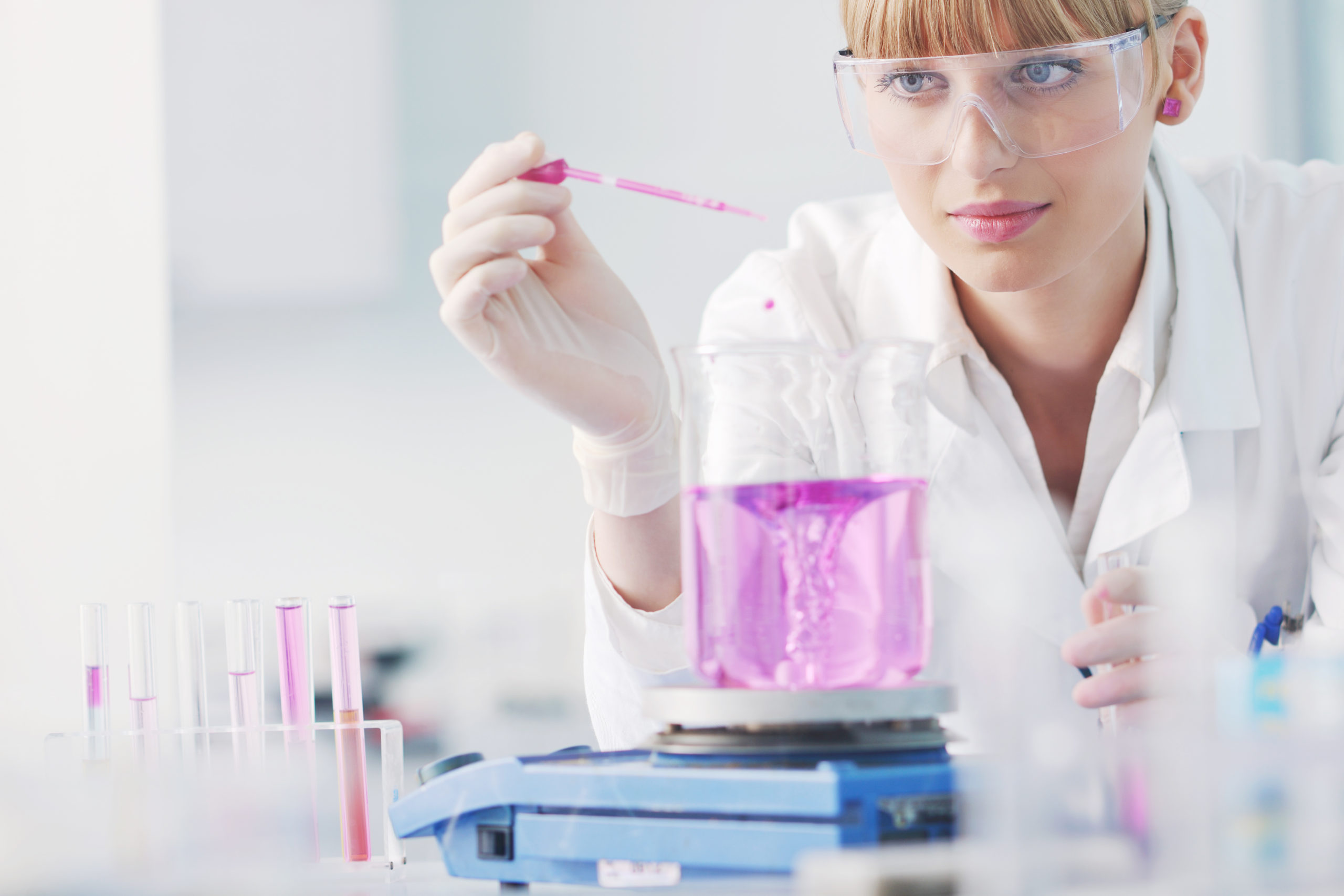 research and science doctor student people in bright labaratory representing chemistry education and medicine concept